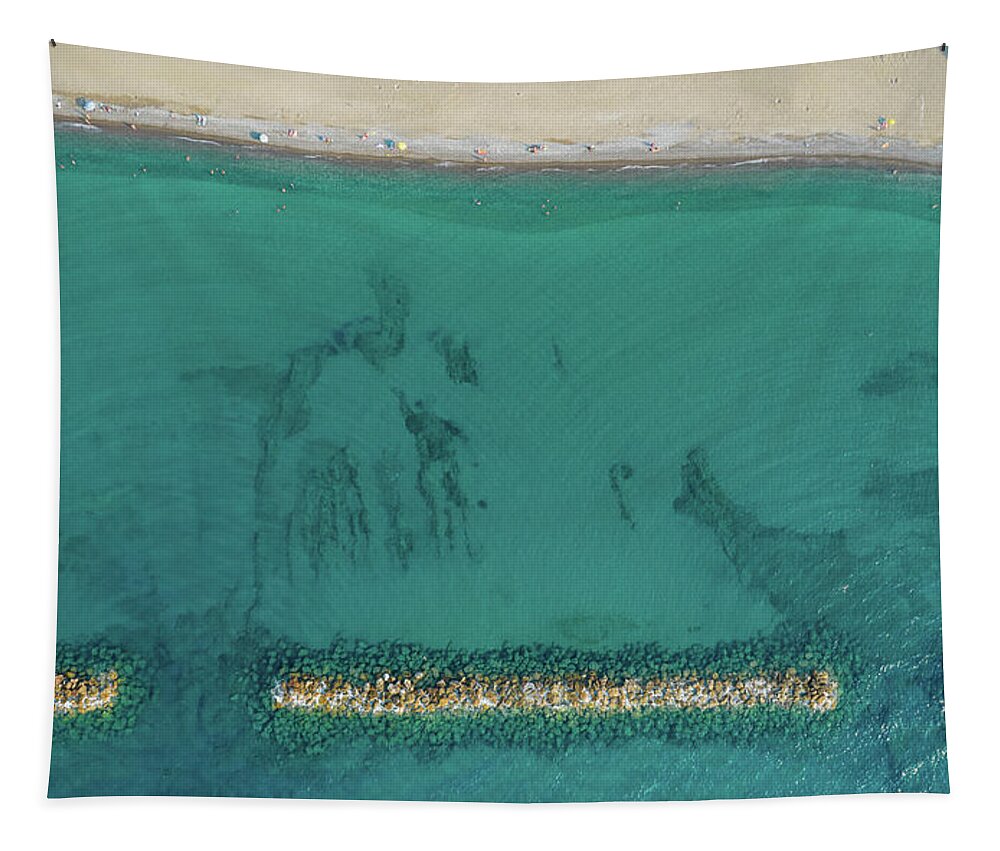 Beachfront Tapestry featuring the photograph Aerial view from flying drone of people relaxing on the beach. Paphos Cyprus by Michalakis Ppalis