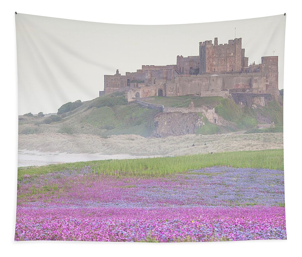 Bamburgh Castle Tapestry featuring the photograph Bamburgh Castle with wild flower meadow by Anita Nicholson