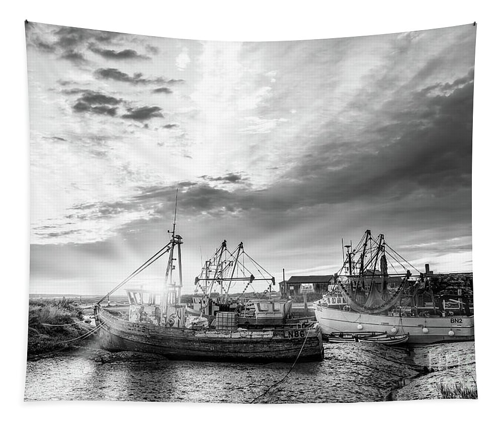 Norfolk Tapestry featuring the photograph Brancaster Norfolk fishing trawlers at sunrise BW by Simon Bratt