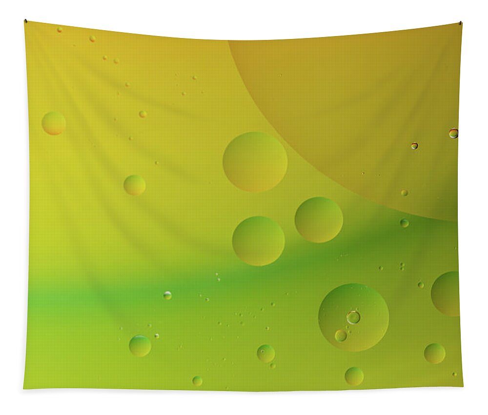 Connection Tapestry featuring the photograph Bright abstract green and yellow background with flying bubbles by Michalakis Ppalis