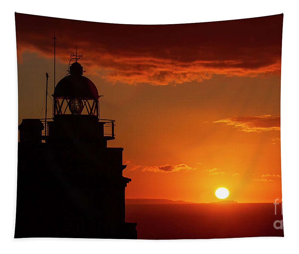 Night Tapestry featuring the photograph Cape Prior Silhouetted Lighthouse against Orange Sky Sunset and Sun at the Horizon Ferrol La Corua Galicia by Pablo Avanzini