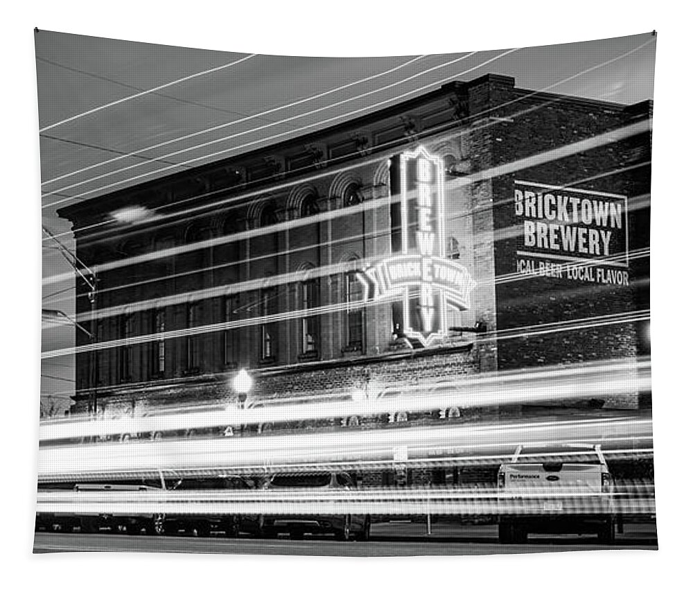 Fort Smith Tapestry featuring the photograph Fort Smith Light Trails And Brewery Neon - Monochrome Panorama by Gregory Ballos