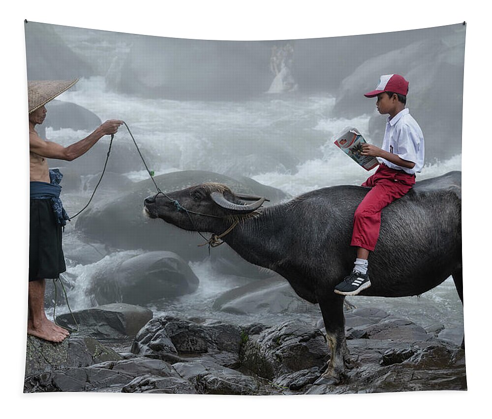 Water Tapestry featuring the photograph Going to school on a water buffalo by Anges Van der Logt