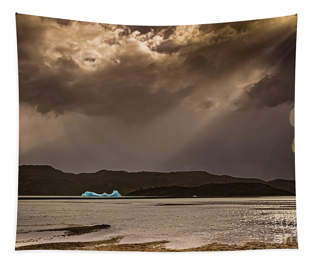 Iceberg Tapestry featuring the photograph Iceberg lit by the sun on Lago Grey by Lyl Dil Creations