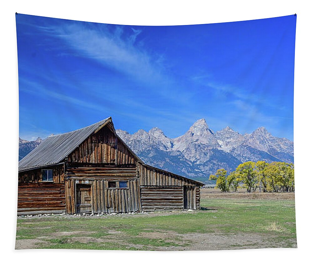 Wyoming Tapestry featuring the photograph Moulton Barn and blue skies by Ed Stokes