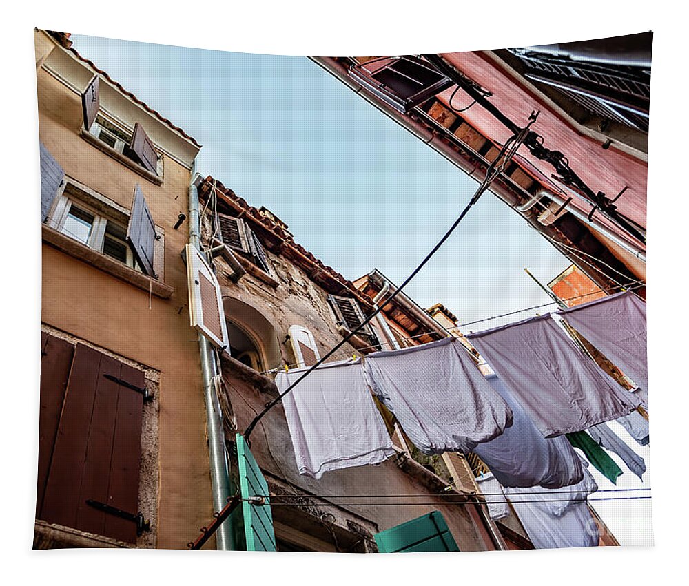 Croatia Tapestry featuring the photograph Narrow Alley With Old Houses And Freshly Washed Laundry In The City Of Rovinj In Croatia by Andreas Berthold