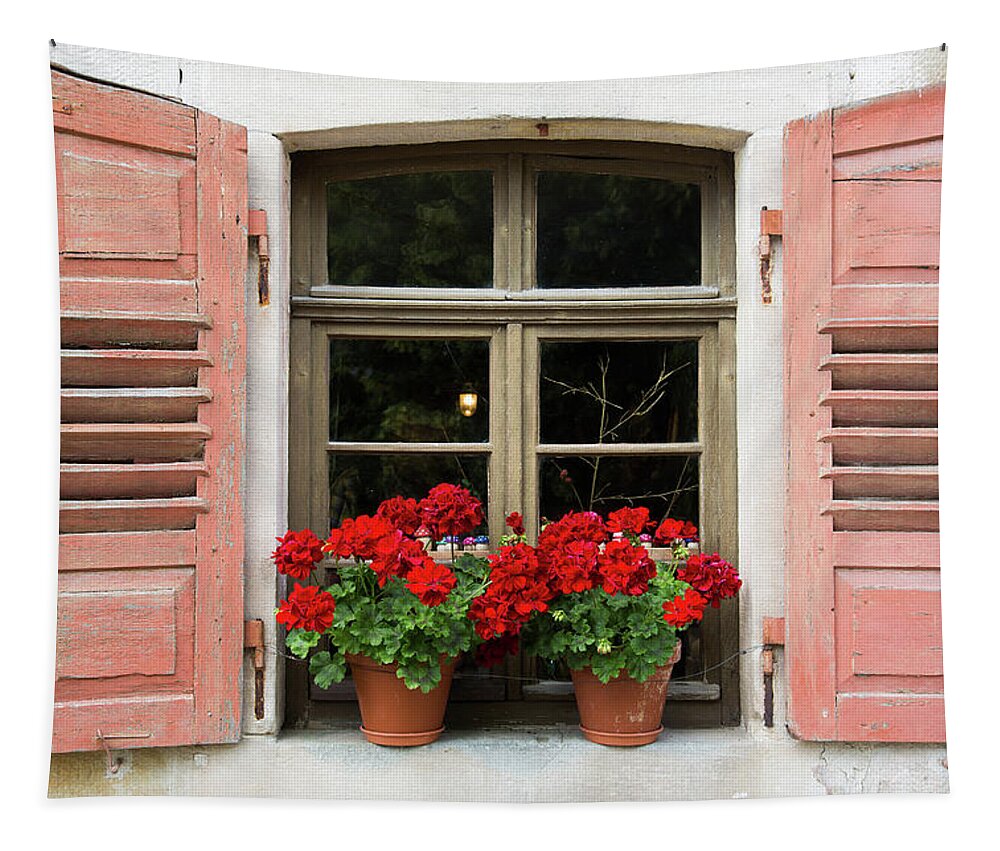 Window Tapestry featuring the photograph Red flowers and red shutters by Karen Kaspar