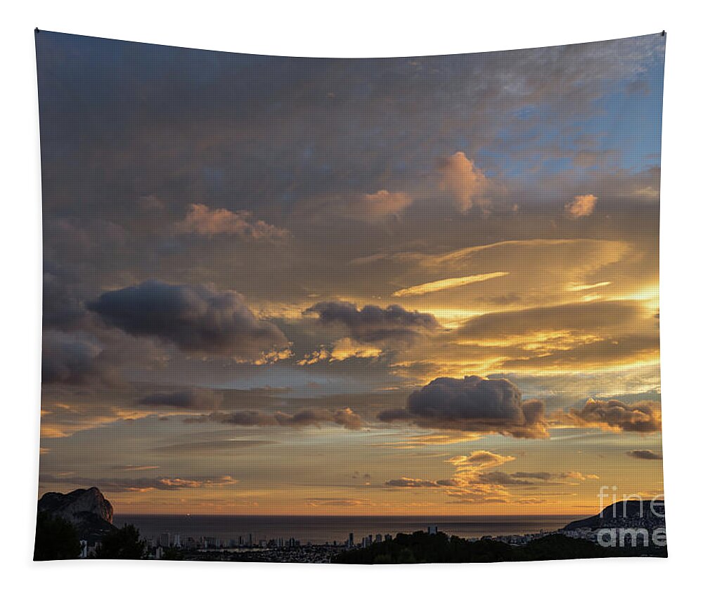 Clouds Tapestry featuring the photograph Scenic sunset sky in Calpe by Adriana Mueller