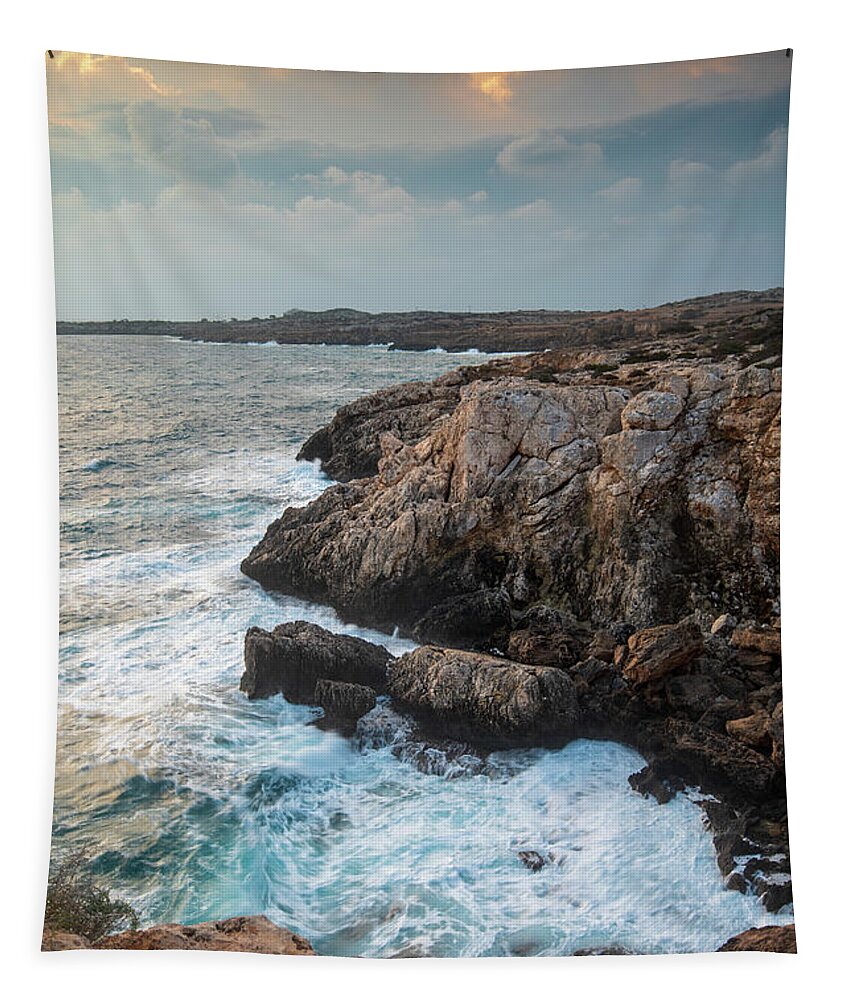 Stormy Sea Tapestry featuring the photograph Seascape with windy waves during stormy weather at sunset. by Michalakis Ppalis