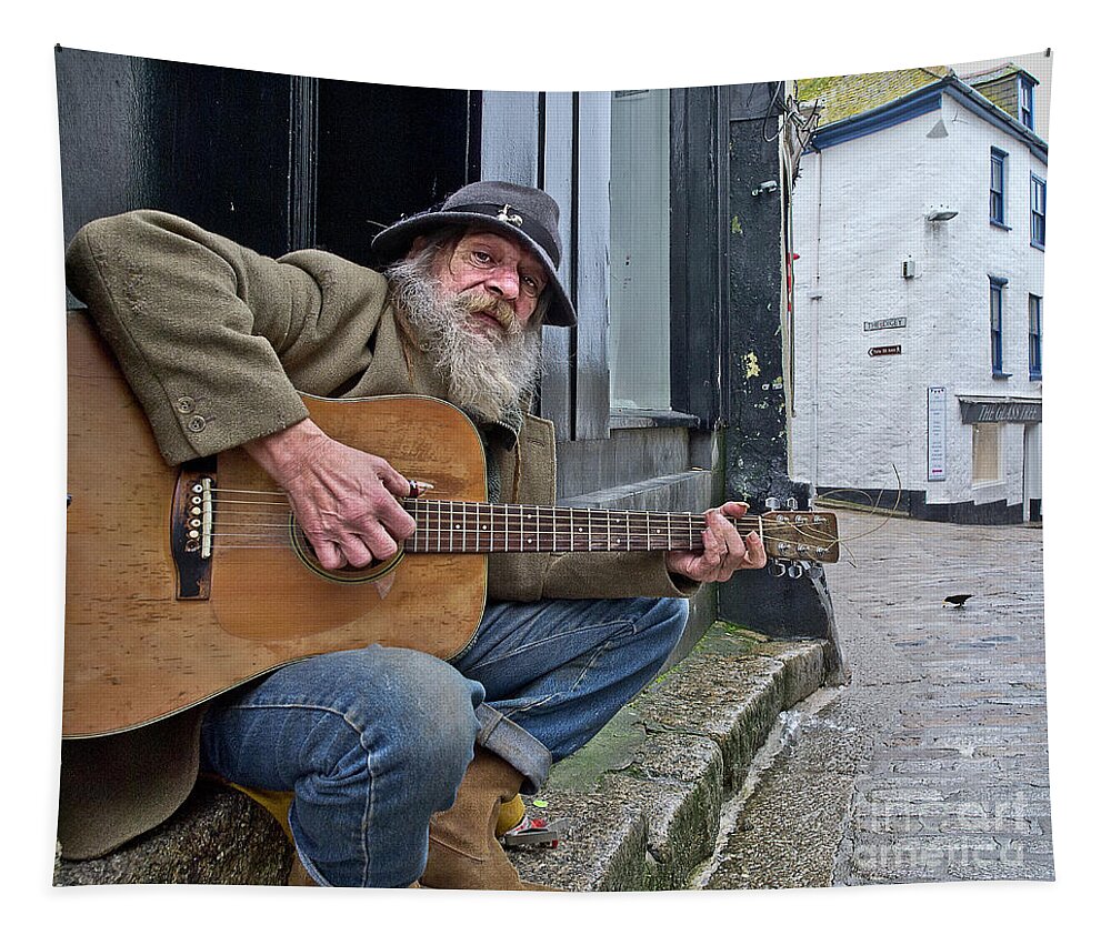 Singer Singing Guitar Audience Crow Character Portrait Effective Expressive Music Musician Laying Performance Hobbies Inspiration Candid St Ives Cornwall Unemployed Poor Homeless Rough Street Sleeping Beggar Begging Self-employed Talent Road Pavement Concert Moustache Beard Scene Theater Inspirational Solitary Solo Alone Eccentric Stage Actor Expression Weird Uncanny Grotesque Stranger Bizarre Sentimental Crow Beauty Public Passion Audience Hat Handsome Instrument Outside Lonely Heaven Lifestyle Tapestry featuring the photograph The audience - homeless singer gives guitar street concert UK by Tatiana Bogracheva