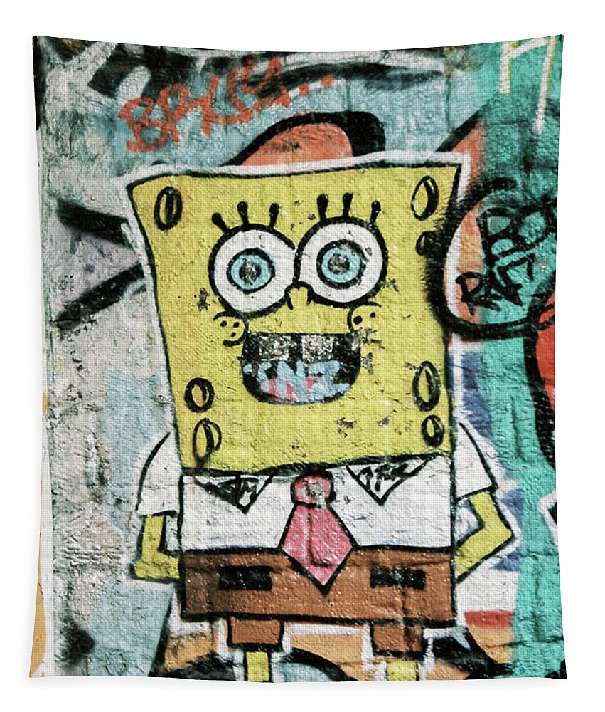 Sponge Tapestry featuring the photograph Sponge Bob stuck on the wall by Barthelemy De Mazenod