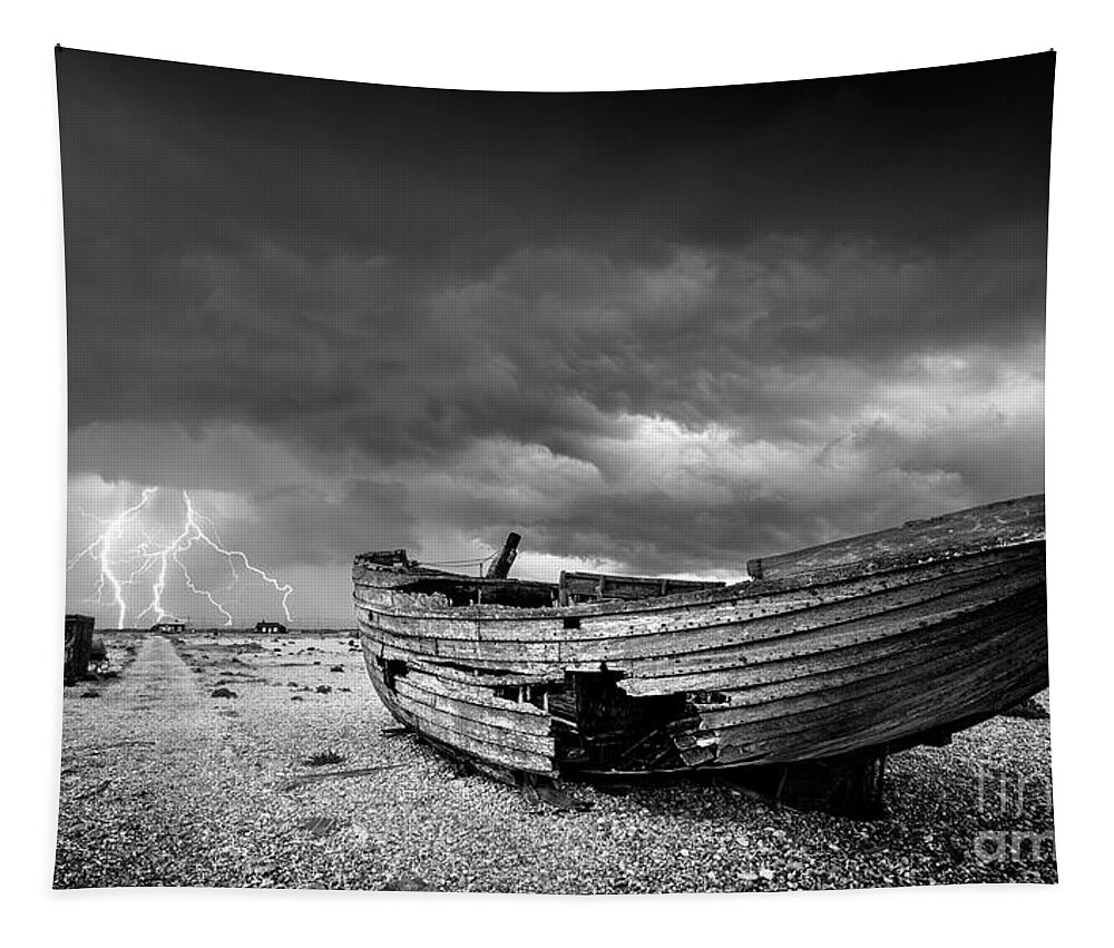 Stormy Sky Tapestry featuring the photograph Stormy Dungeness, Wrecked boat on a shingle beach with lightning by Neale And Judith Clark