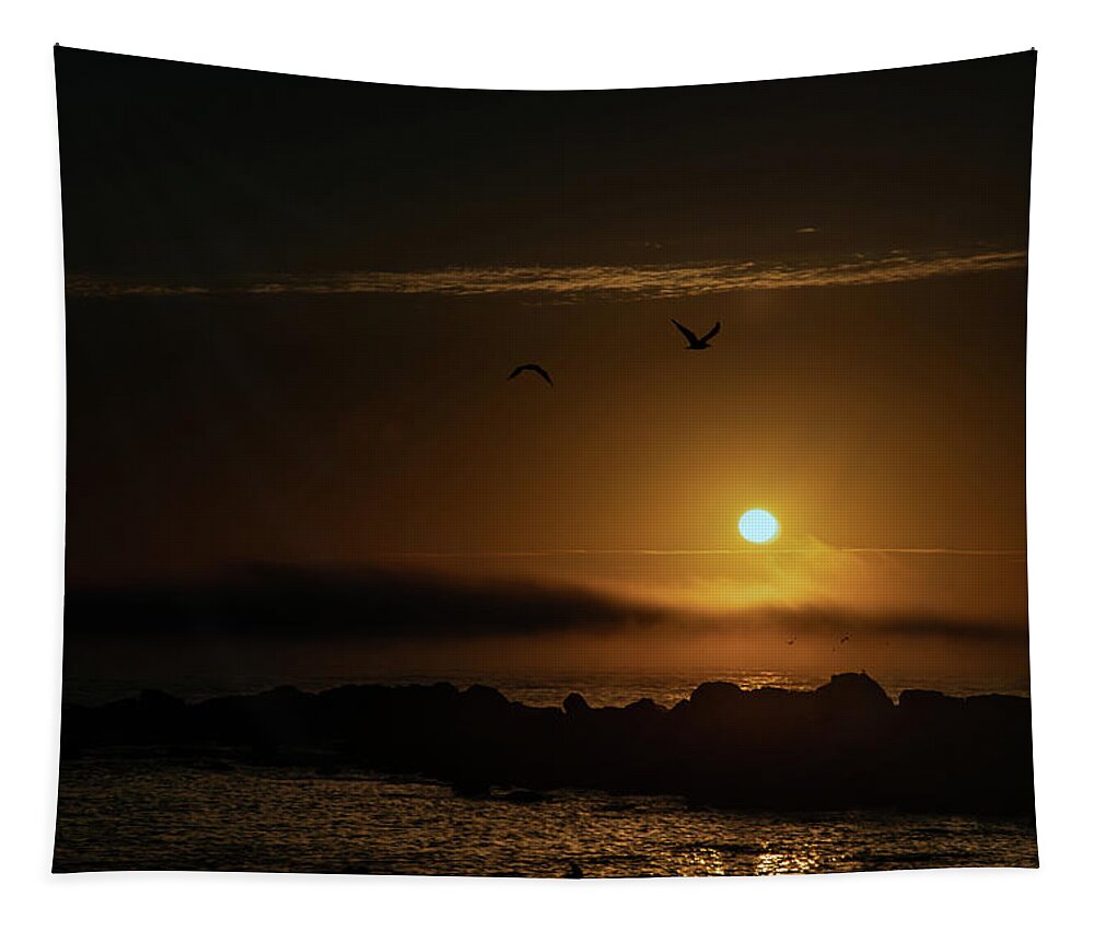 Sunset Tapestry featuring the photograph Sunset over the ocean by Micah Offman