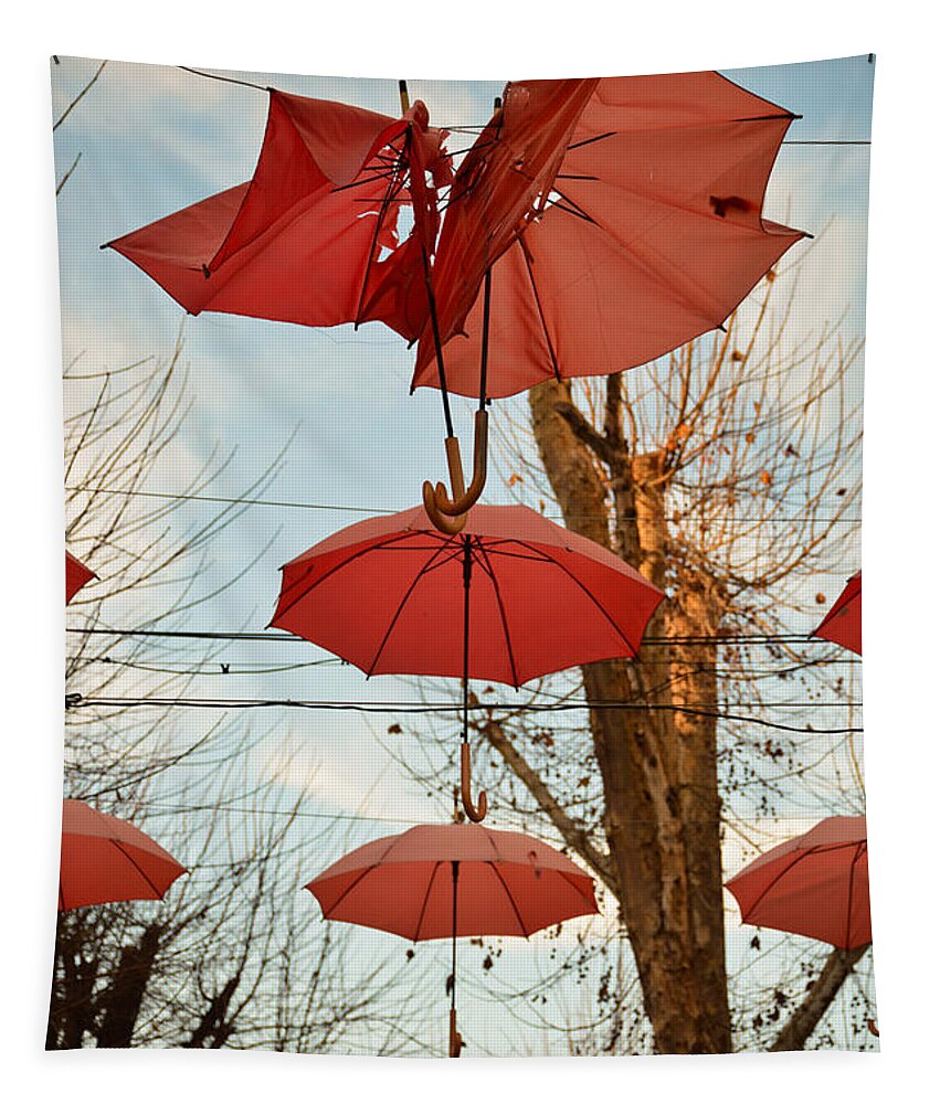 Umbrellas Tapestry featuring the photograph The clash of the umbrellas by Yavor Mihaylov