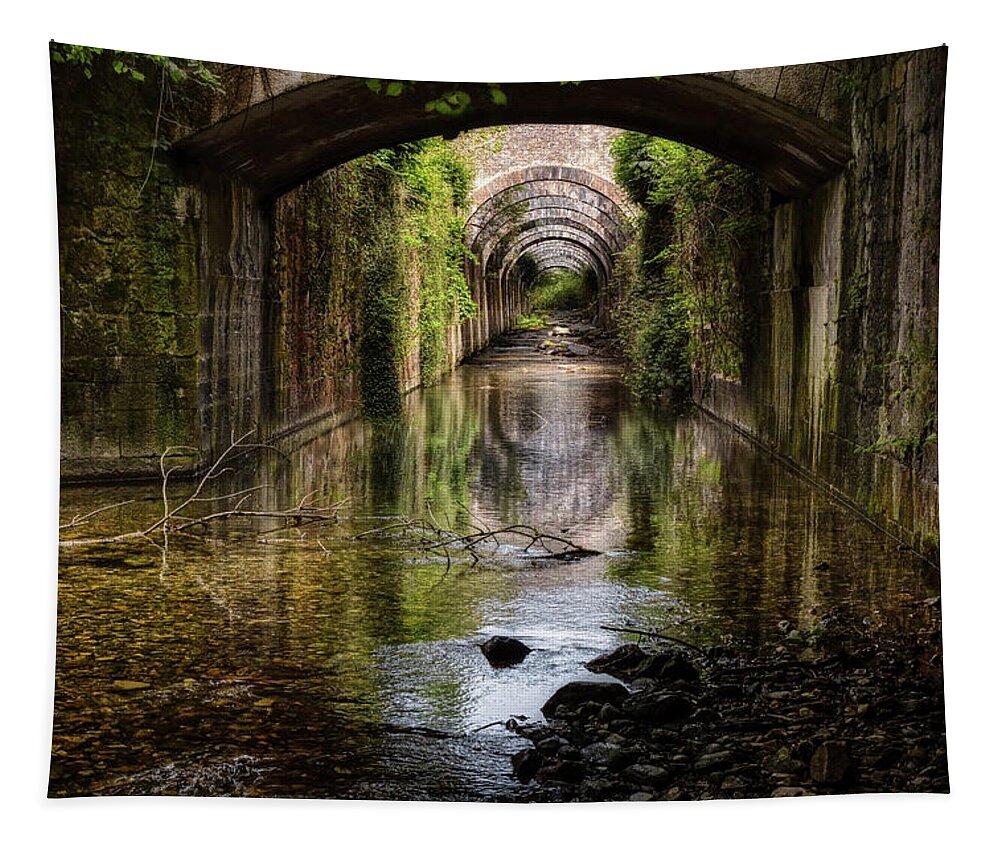 Factory Tapestry featuring the photograph The mysterious canal under an abandoned factory by Micah Offman