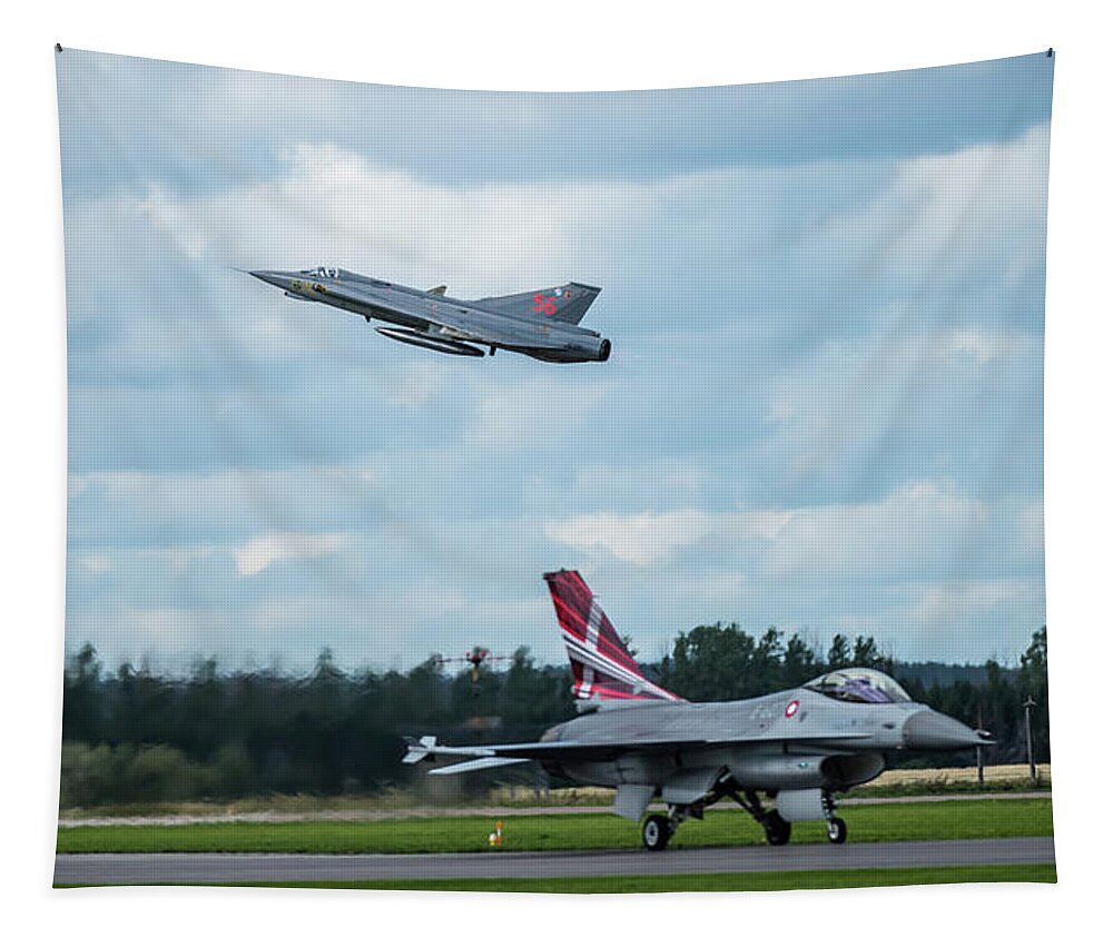 Take Off Tapestry featuring the photograph The retired Swedish J35 Draken take off and the taxing Danish F16 Fighting Falcon by Torbjorn Swenelius