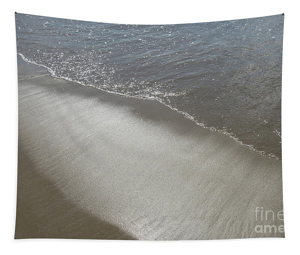 Sandy Beach Tapestry featuring the photograph Wet sand, sea water and reflections of sunlight 2 by Adriana Mueller