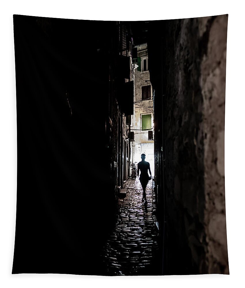  Tapestry featuring the photograph Young Woman Walks Alone Through Spooky Narrow Abandoned Alley In The Night by Andreas Berthold