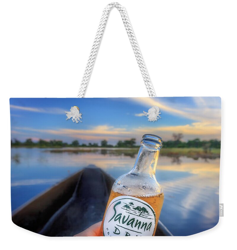 Africa Weekender Tote Bag featuring the photograph Mokoro Dry Sundowner by Sylvia J Zarco