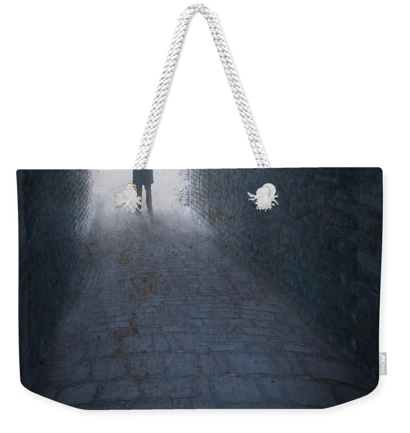 Man Weekender Tote Bag featuring the photograph Victorian Or Edwardian Man With Top Hat Standing At The End Of by Lee Avison