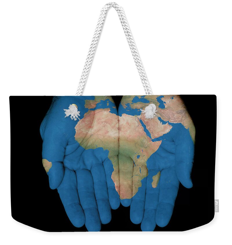 World Map Weekender Tote Bag featuring the photograph Africa In Our Hands by Jim Vallee