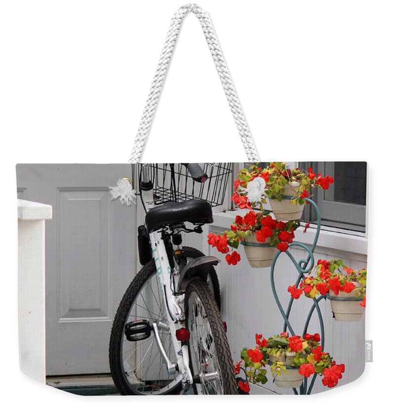 Bicycle Weekender Tote Bag featuring the photograph Bicycles and Geraniums by Jackson Pearson