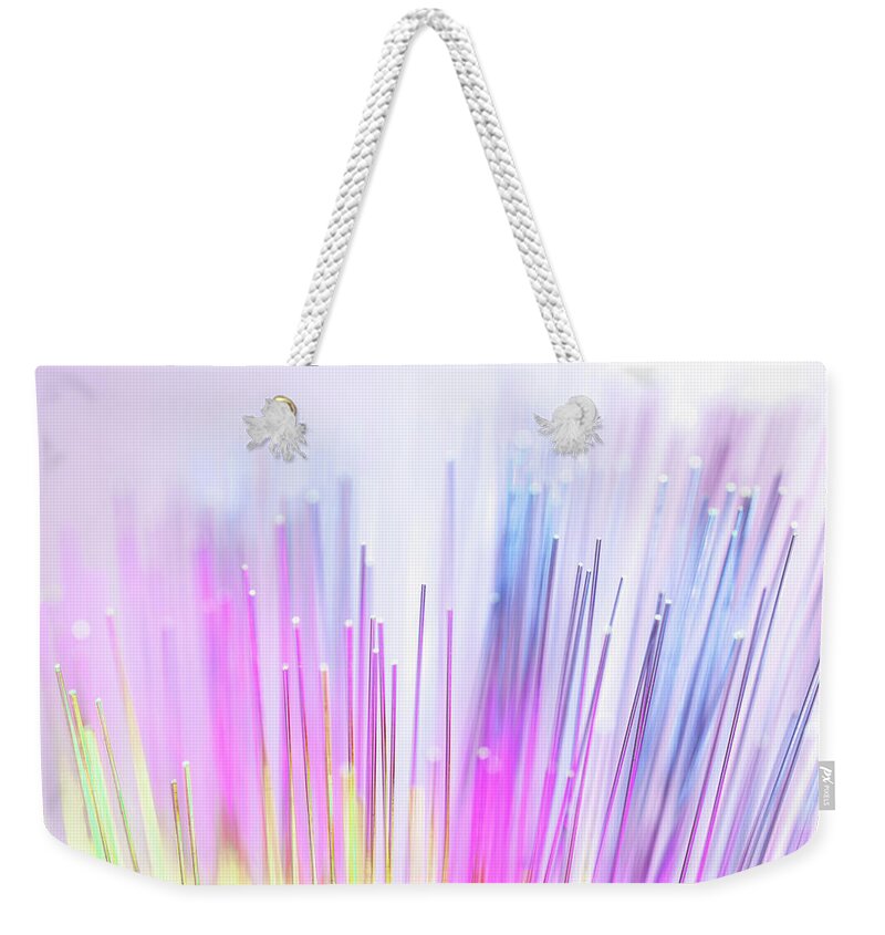 White Background Weekender Tote Bag featuring the photograph Close Up Of Colorful Optic Fibers #1 by Andrew Brookes