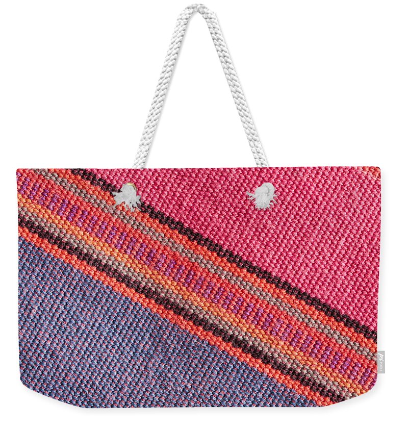 Abstract Weekender Tote Bag featuring the photograph Colorful cloth #1 by Tom Gowanlock