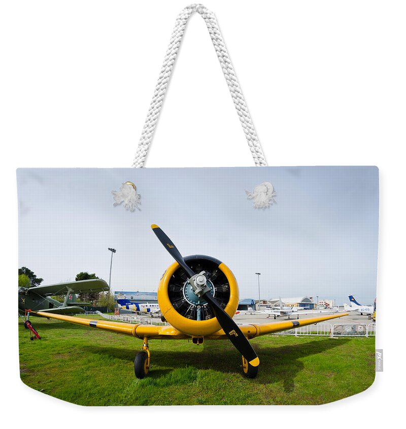 Cuatro Weekender Tote Bag featuring the photograph North American T-6 Texan by Pablo Lopez