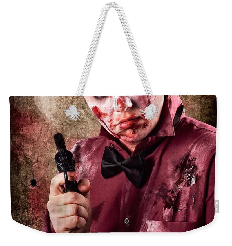 Horror Weekender Tote Bag featuring the photograph Evil demented zombie holding hand gun. Robbery #1 by Jorgo Photography