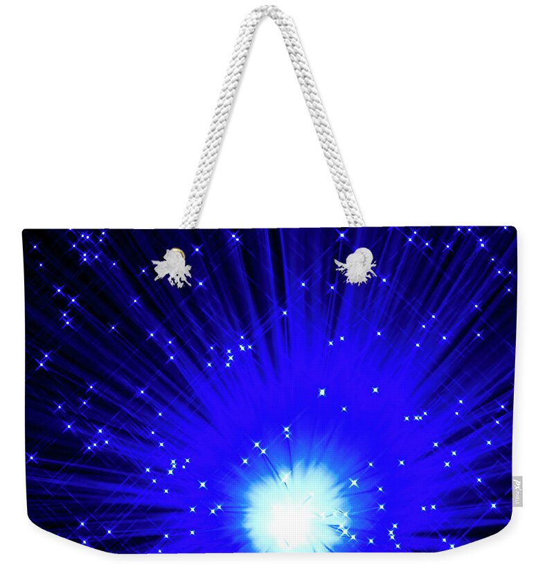 Black Background Weekender Tote Bag featuring the photograph Fiber Optics On Black Background #1 by Level1studio