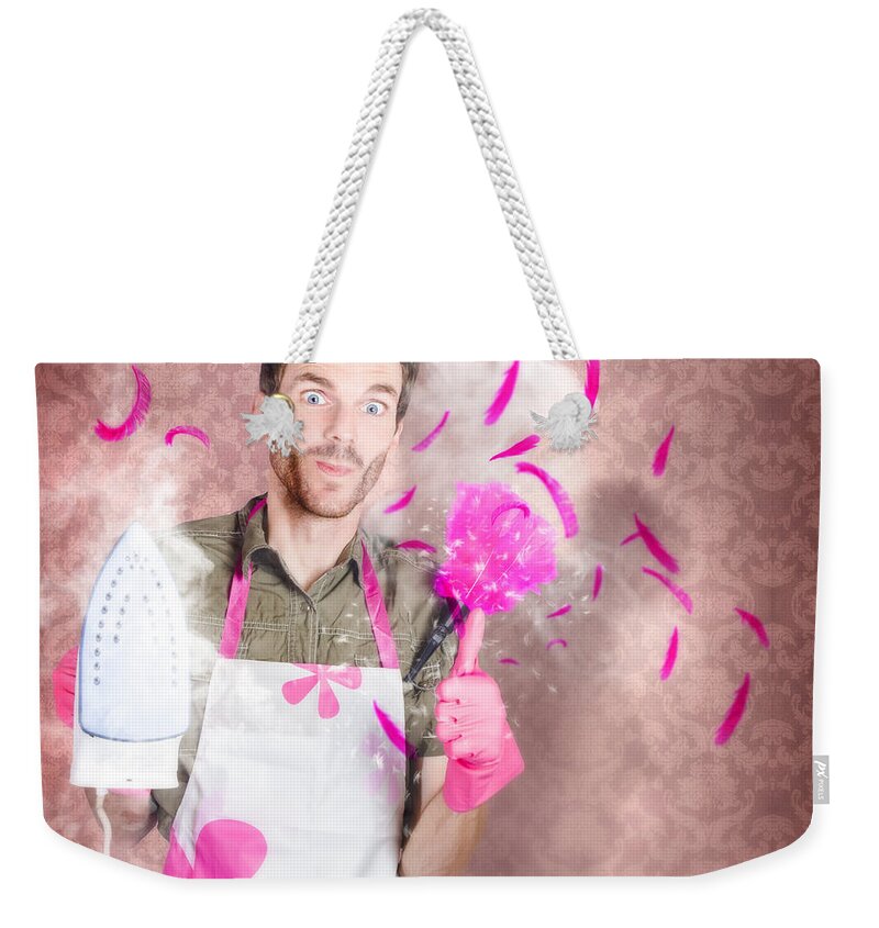 Cleaning Weekender Tote Bag featuring the photograph Funny cleaning man doing housework chores #1 by Jorgo Photography