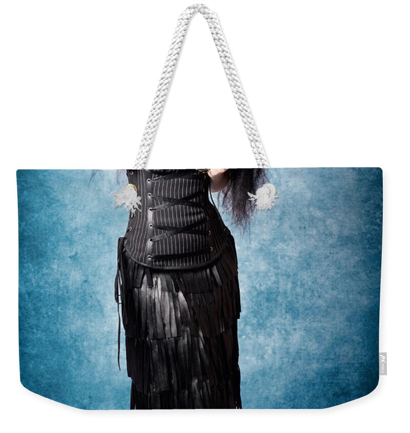 Black Weekender Tote Bag featuring the photograph Gothic female fashion model. Elegant black outfit #1 by Jorgo Photography