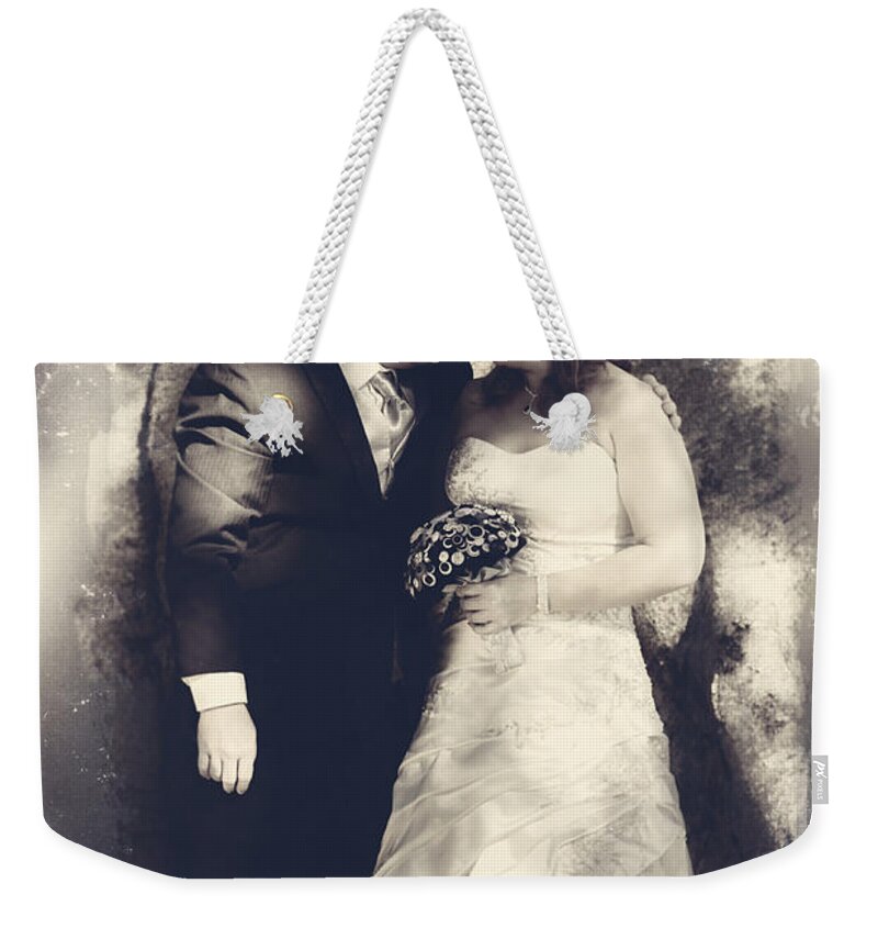 Bride Weekender Tote Bag featuring the photograph Happy bride and groom in a wedding romance #1 by Jorgo Photography