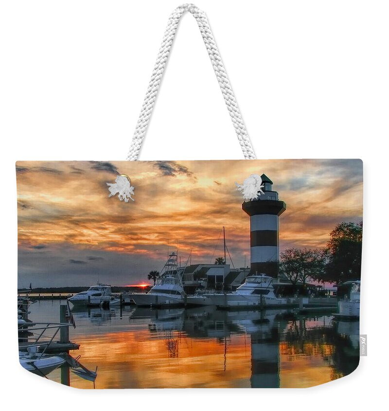 Lighthouse Weekender Tote Bag featuring the photograph Harbour Town Sunset by Dale Kauzlaric