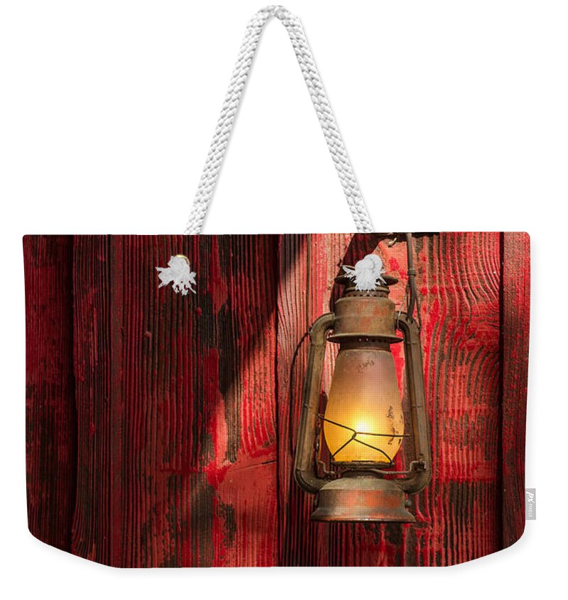 West Weekender Tote Bag featuring the photograph Kerosene Lantern #1 by Carlos Caetano