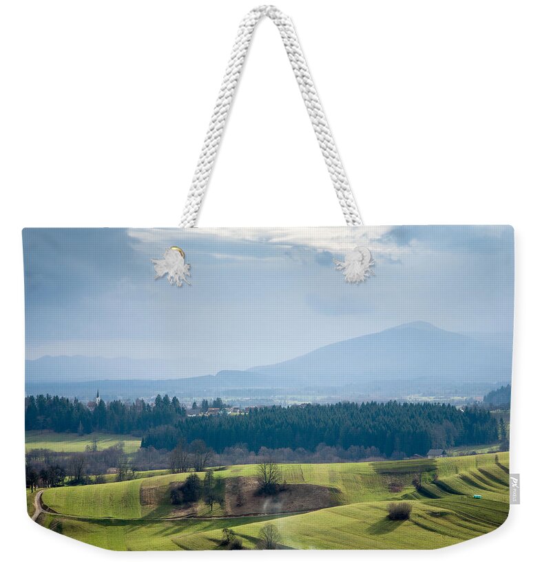 Mountains Weekender Tote Bag featuring the photograph Morning light over karst fields #1 by Ian Middleton