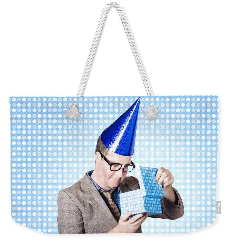 Bonus Weekender Tote Bag featuring the photograph Nerdy business man opening surprise present #1 by Jorgo Photography