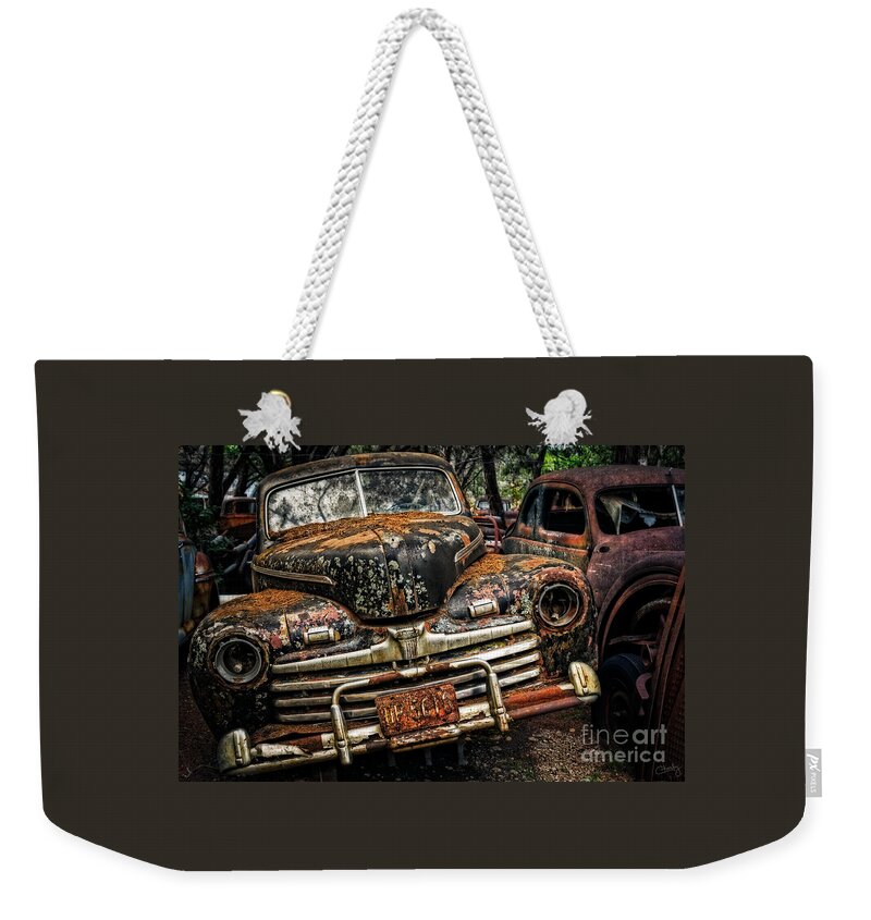 Old Ford Weekender Tote Bag featuring the photograph Old Rusty Ford by Imagery by Charly