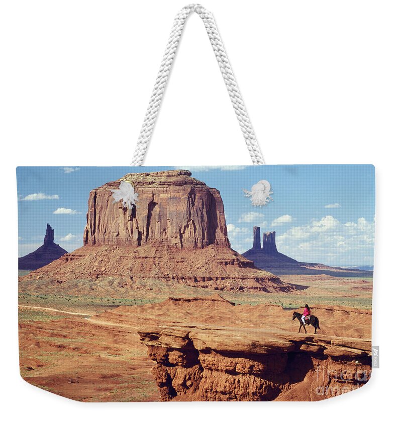 Nature Weekender Tote Bag featuring the photograph Rider At Monument Valley #1 by Adam Sylvester