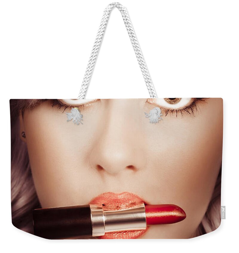 Makeup Weekender Tote Bag featuring the photograph Surprised pinup girl with lipstick makeup in mouth #1 by Jorgo Photography