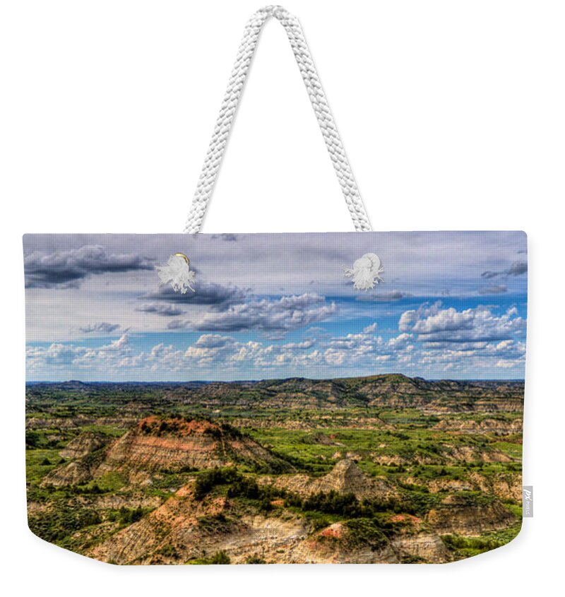Painted Hills Weekender Tote Bag featuring the photograph The Badlands #1 by Jonny D