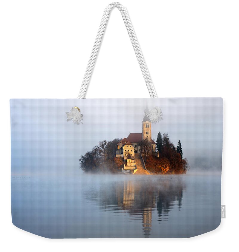 Bled Weekender Tote Bag featuring the photograph Through the mist #1 by Ian Middleton