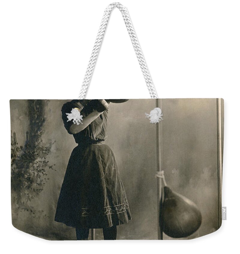 1890 Weekender Tote Bag featuring the photograph Woman Boxing Workout #2 by Underwood Archives