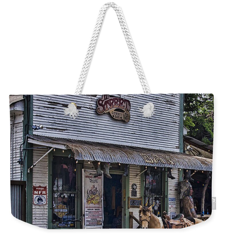 11th Street Cowboy Bar Weekender Tote Bag featuring the photograph 11th Street Cowboy Bar in Bandera Texas by Priscilla Burgers