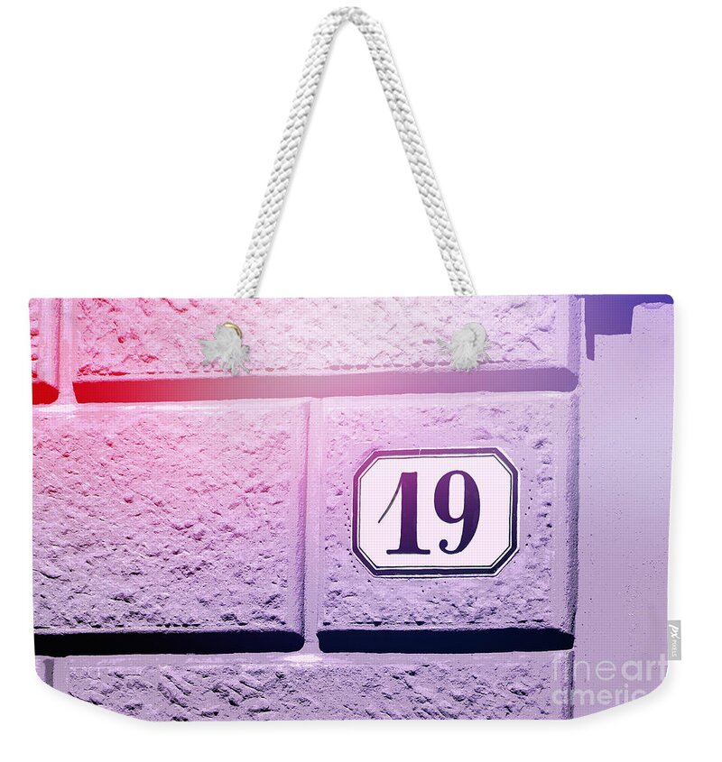 Nineteen Weekender Tote Bag featuring the photograph 19 on Lavender Wall by Valerie Reeves