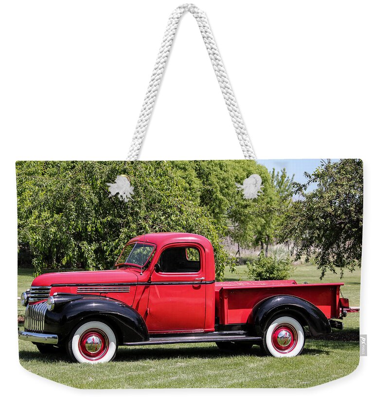 1946 Chevrolet Weekender Tote Bag featuring the photograph 1946 Chevy Pickup by E Faithe Lester