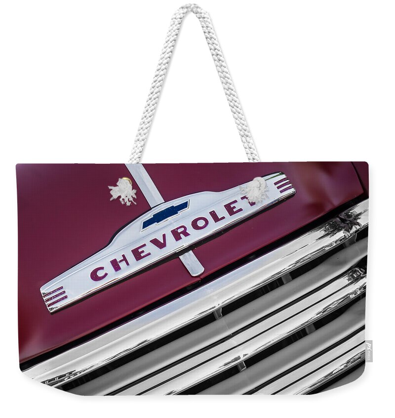 1951 Weekender Tote Bag featuring the photograph 1951 Chevy Truck Emblem and Grill by Ron Pate