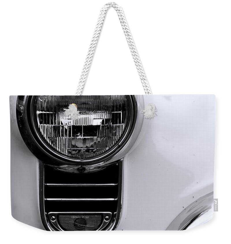 Automobile Weekender Tote Bag featuring the photograph 1952 Olds Headlight by Ron Roberts