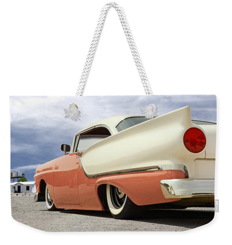 1957 Ford Weekender Tote Bag featuring the photograph 1957 Ford Fairlane Lowrider by Mike McGlothlen